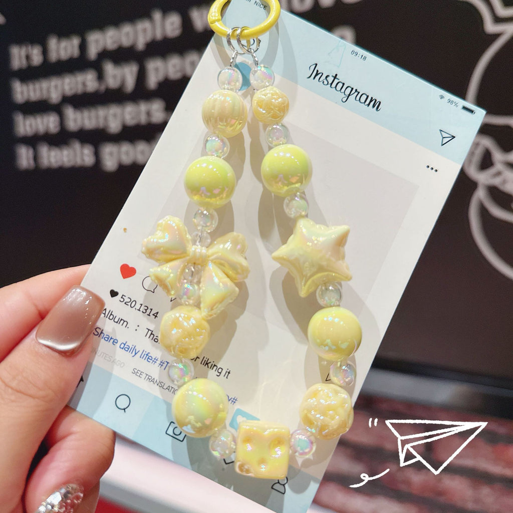 English: Iridescent Bow & Star Acrylic Phone Charm Strap