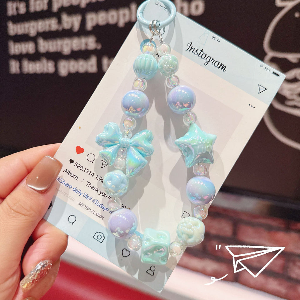 English: Iridescent Bow & Star Acrylic Phone Charm Strap
