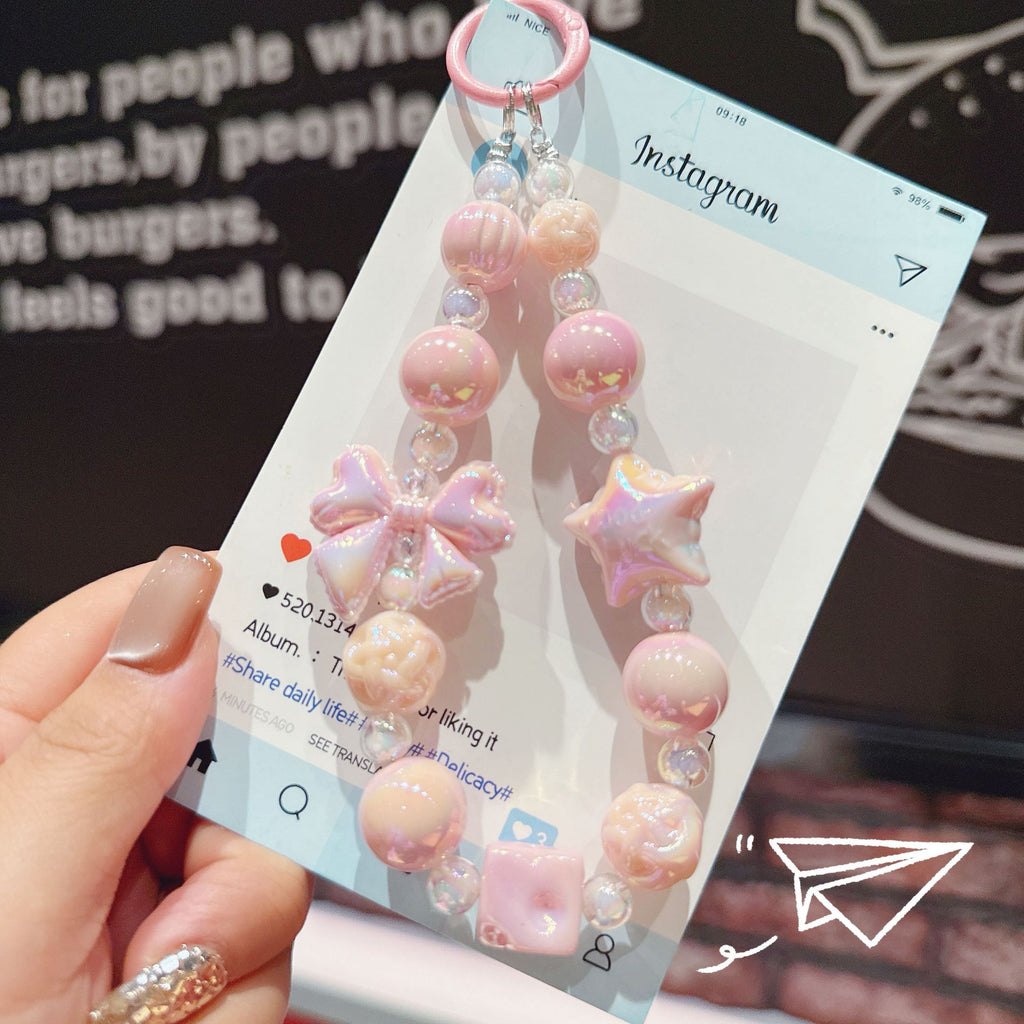 English: Iridescent Bow & Star Acrylic Phone Charm Strap