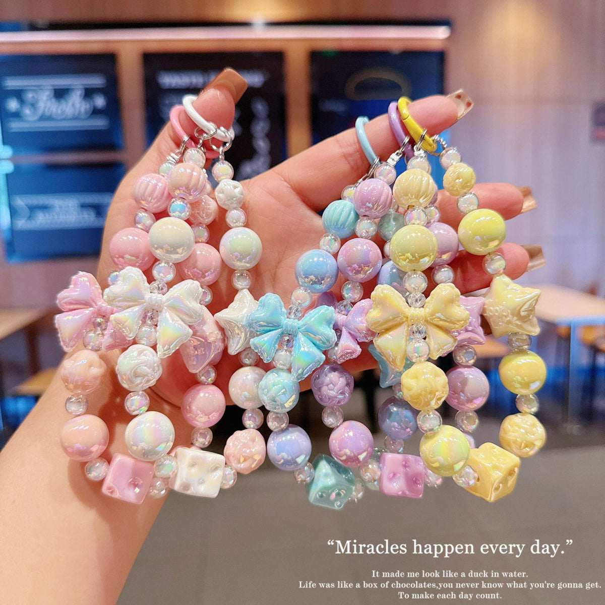 English: Iridescent Bow & Star Acrylic Phone Charm Strap