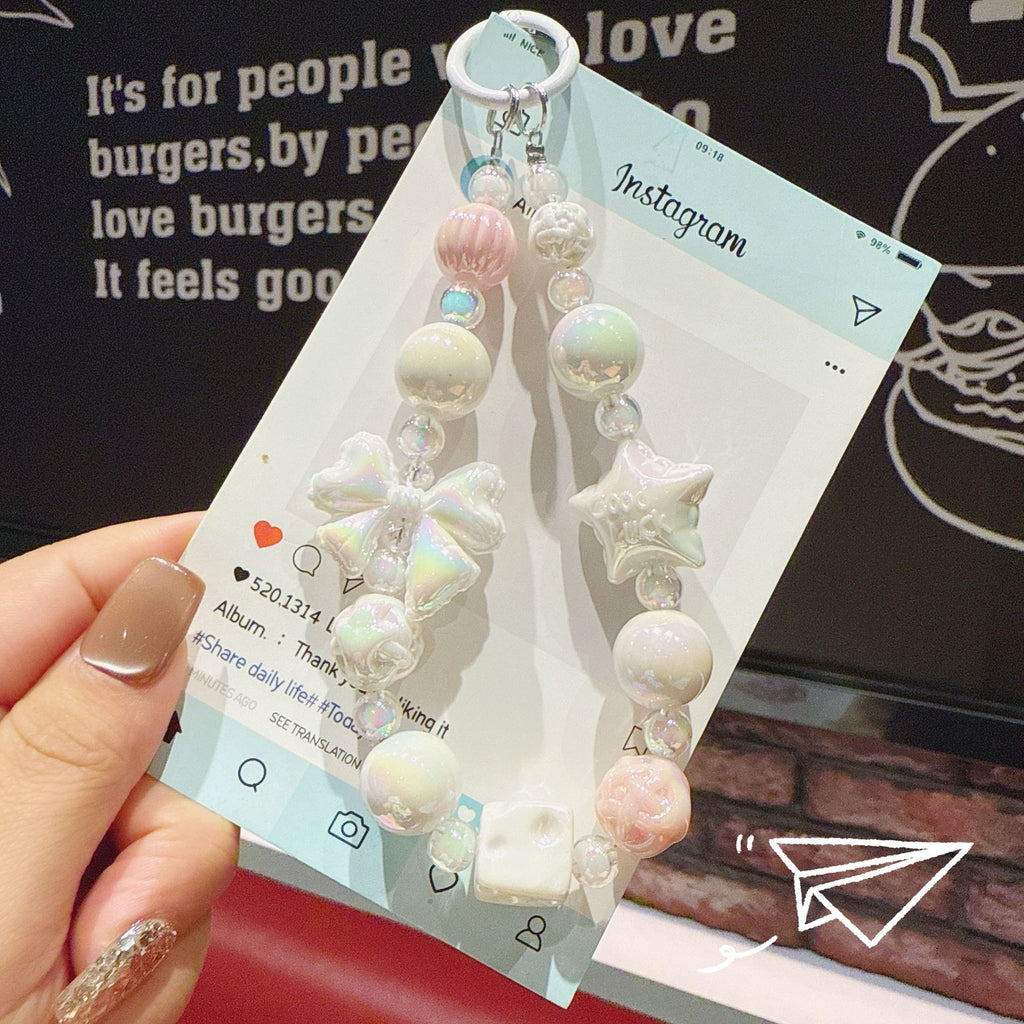 English: Iridescent Bow & Star Acrylic Phone Charm Strap